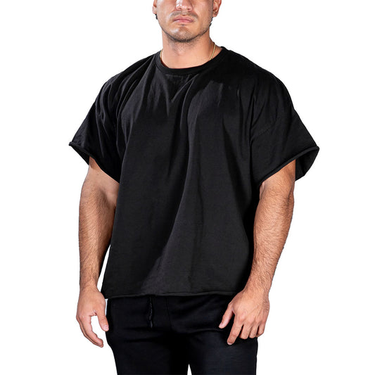 Man in a black GYMPUK t-shirt and pants against a white background.