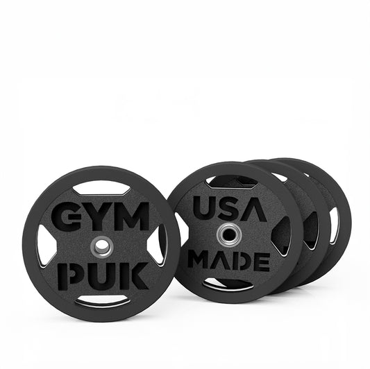 Stacked black weight plate-shaped deodorizers with 'GYMPUK' and 'USA MADE'.