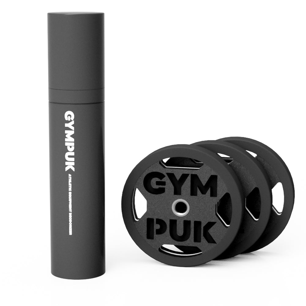 Black spray bottle with 'GYMPUK' next to stacked weight plate-shaped deodorizers.